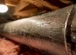 Close-up of sweating duct with water droplets