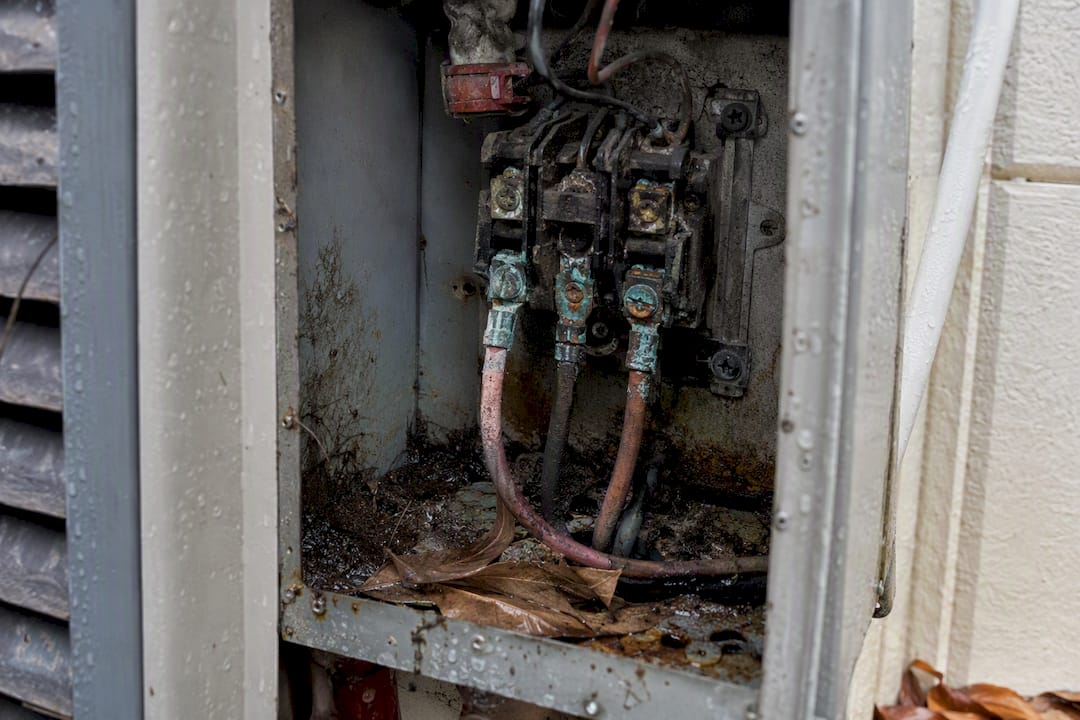 Corroded wiring in outdoor AC disconnect box