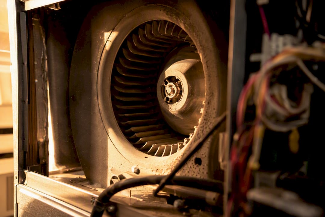 Blower fan blades spinning inside HVAC unit