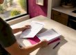 Homeowner organizing HVAC rebate paperwork