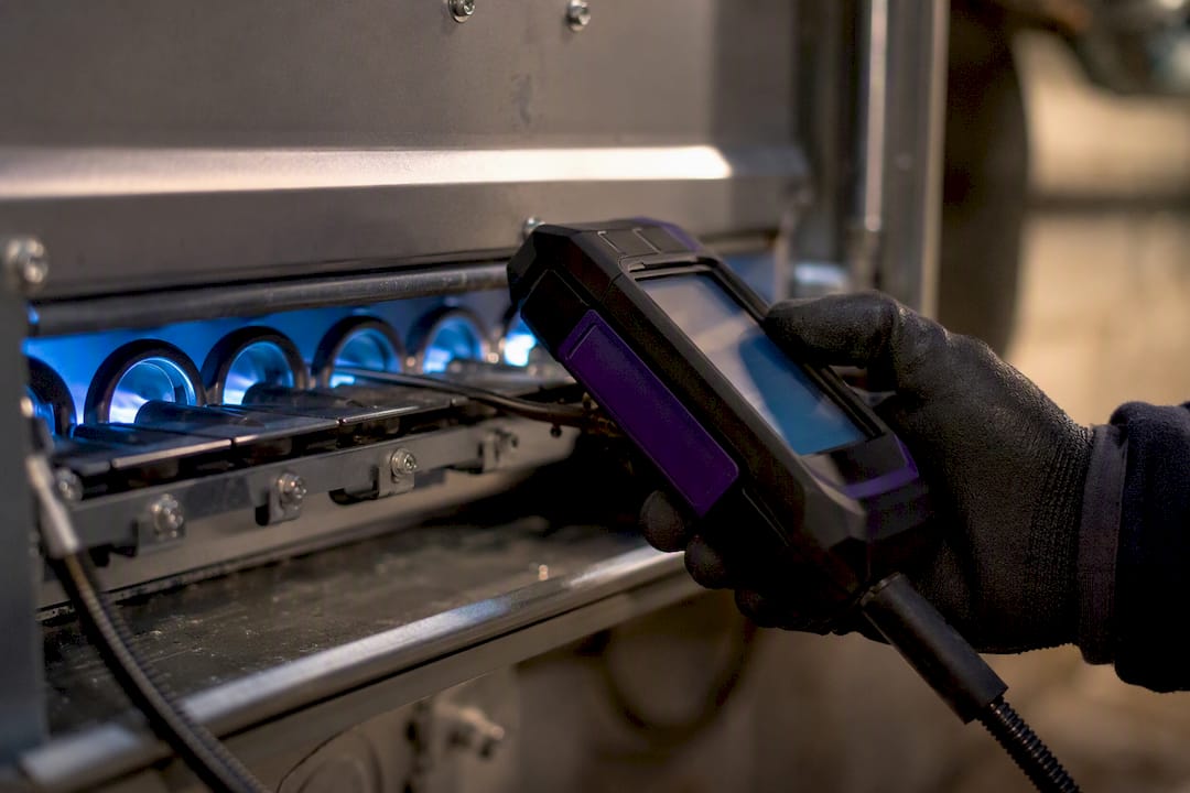 Technician performing furnace combustion analysis