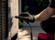 Technician checking vibration on AC panel