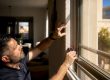 Technician measuring a residential window