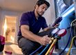 Technician checking AC commissioning measurements