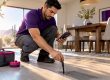 Technician measuring airflow at floor register