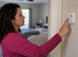 Homeowner testing a carbon monoxide alarm