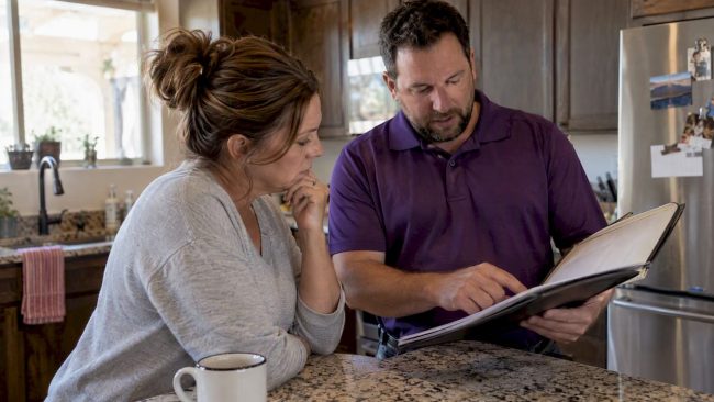 Homeowner reviewing an HVAC maintenance agreement