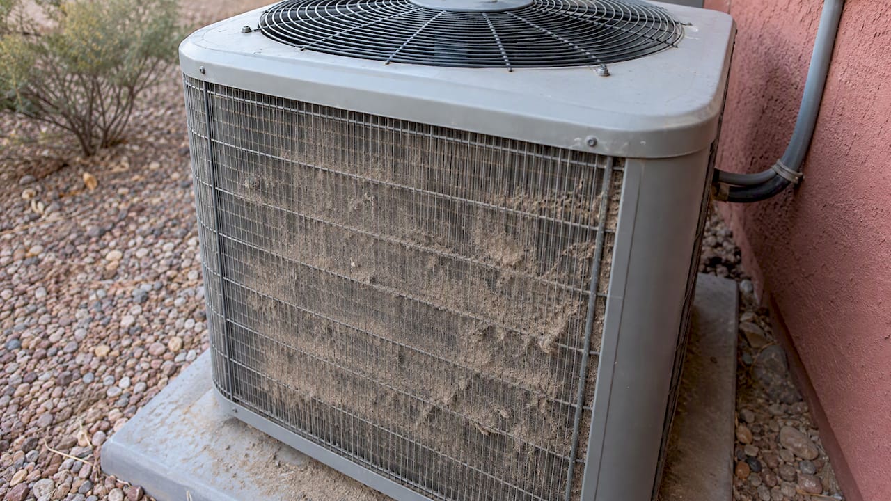Desert dust coating an outdoor condenser coil